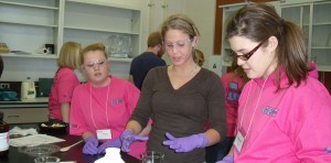 Instructor working with two k-12 students.