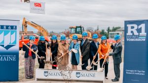 A photo of a group with shovels during a groundbreaking